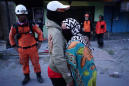 Girl scout among 34 dead found in Indonesian quake quagmire