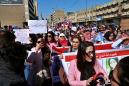 Women protesters in Iraq defy radical cleric, take to street