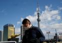 Japan seeks to contain economic impact of virus, new measures come into effect