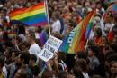 Polish rights campaigners gather in Warsaw to condemn homophobic violence
