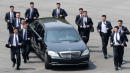Kim Jong Un's Bevy Of Bodyguards Are Back — And Yes, They're Still Running