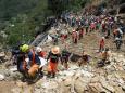 Philippine miners dig for their own in typhoon landslide