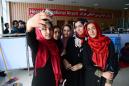 Afghan girls robotics team land in US after visa U-turn