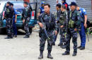 Philippines says Islamists keep up week-long fight with prisoners, looted guns