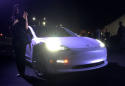 Tesla's Musk hands over first Model 3 electric cars to early buyers