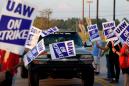 GM stops paying for health insurance for striking union workers; talks continue