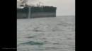 Crude oil tanker in the Persian Gulf caught fire Wednesday night